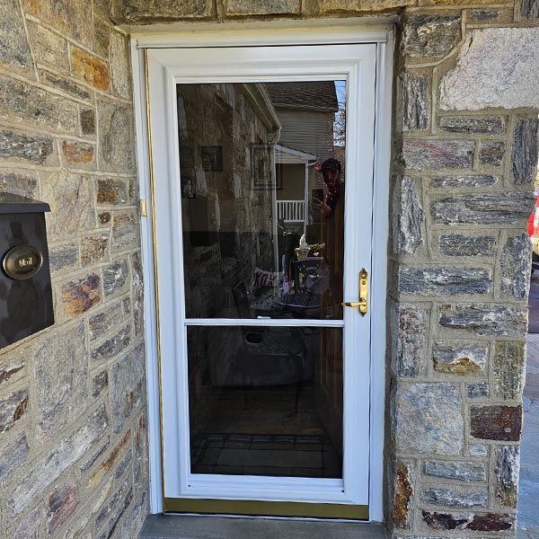 white storm door with gold hardware in Oreland PA